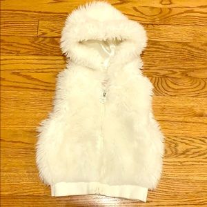 White fur vest